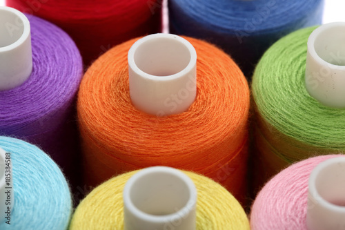 A colorful spool with threads often used in tailoring and is an indispensable element of this profession. 