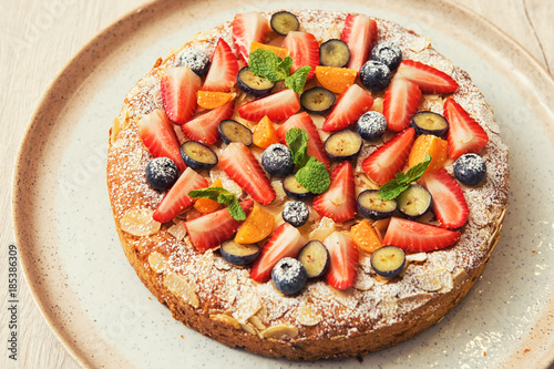 Sweet fresh cakes with frui...