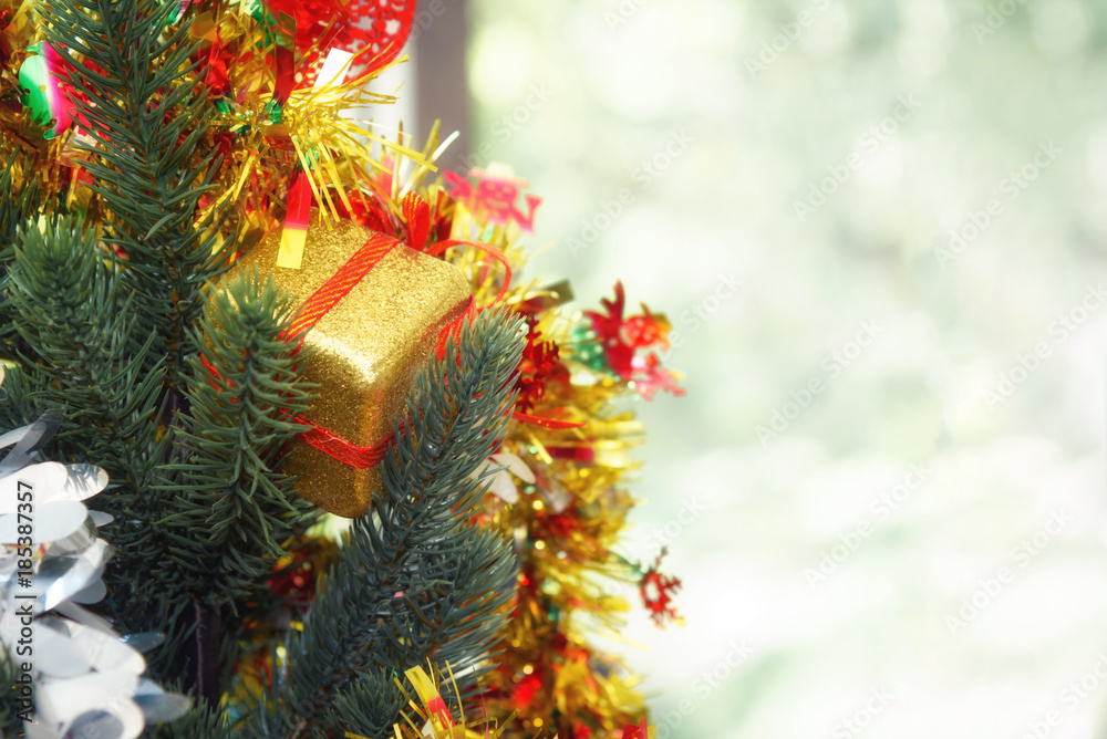 Decorated Christmas tree and gift with blur background