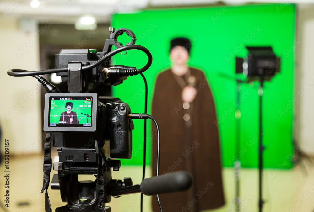 The actor starred in the interior on a green background. The chroma key. Filming equipment. The actor starred in the interior on a green background. The chroma key. Filming equipment.