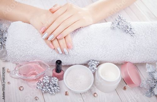 Beautiful pink and silver Christmas manicure with spa essentials