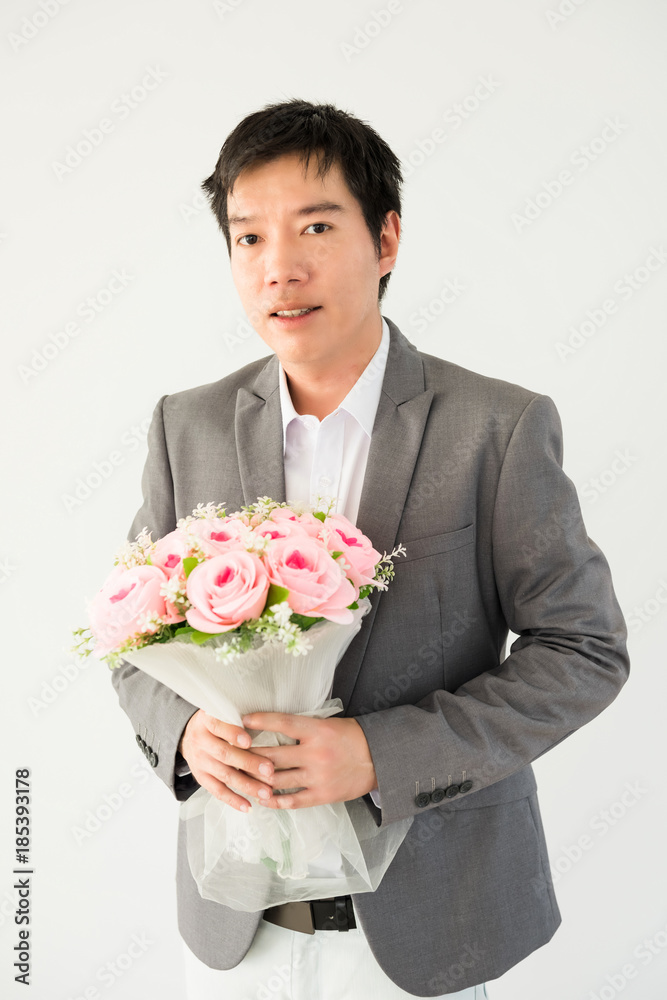 Handsome businessman holding flower bouquet Handsome businessman holding flower bouquet