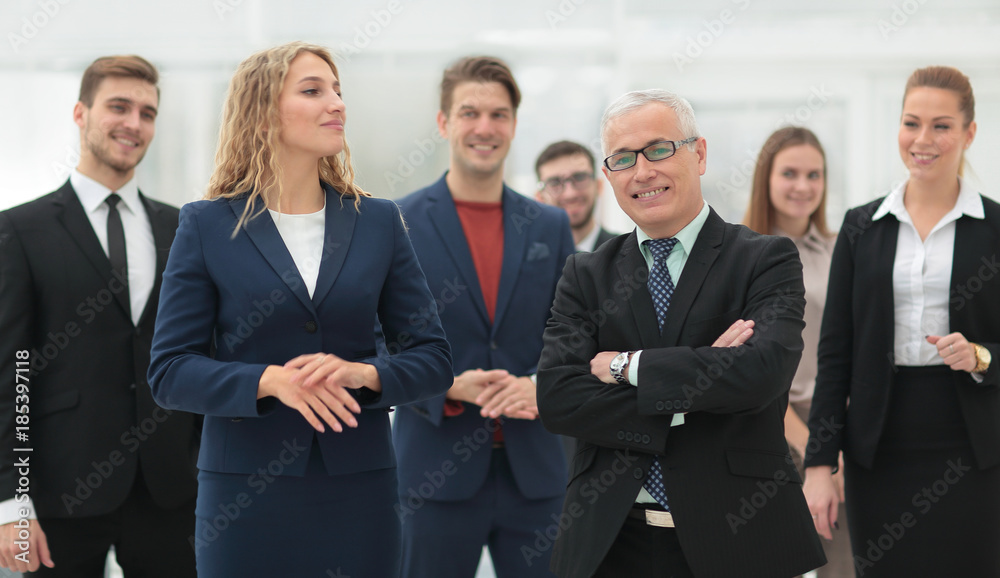 businessman and business woman standing in front of the business team. businessman and business woman standing in front of the business team.