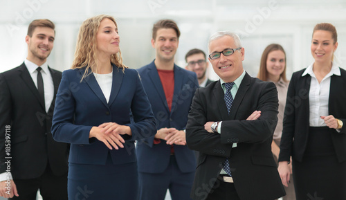 businessman and business woman standing in front of the business team. © ASDF