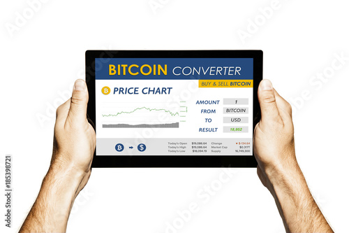 Bitcoin converter website in a tablet screen. Hands holding tablet with white background.