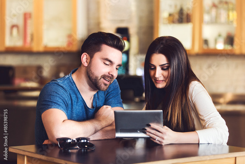 Happy young couple in cafe