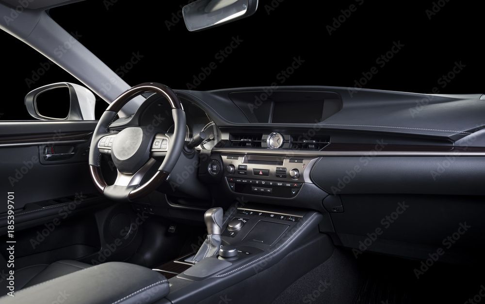 Modern luxury car  interior, dashboard, steering wheel, wood panels. Stitched black perforated  leather interior, clipping path for isolated windows included.