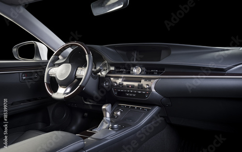 Modern luxury car  interior, dashboard, steering wheel, wood panels. Stitched black perforated  leather interior, clipping path for isolated windows included. © gargantiopa