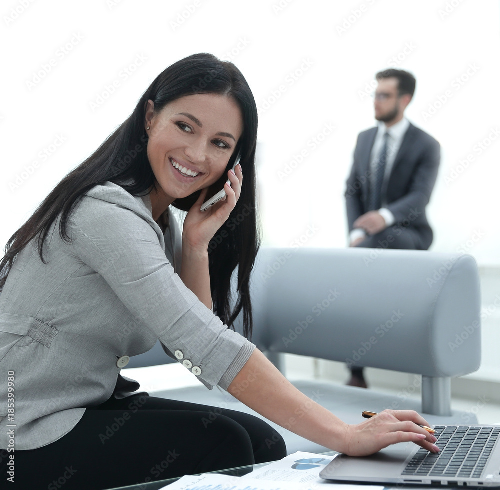 Woman assistant at her workplace. Woman assistant at her workplace.