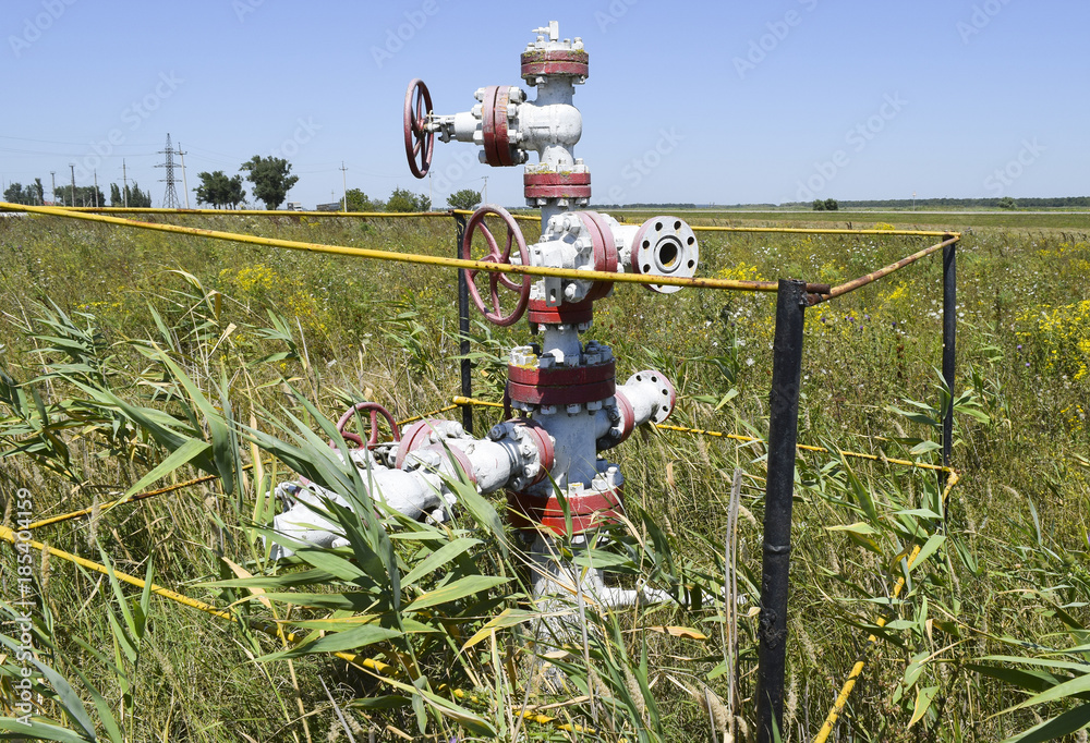 Well for oil and gas production. Oil well wellhead equipment. Oil production Well for oil and gas production. Oil well wellhead equipment. Oil production