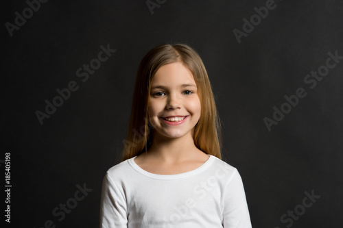 Kid model smiling with long healthy hair