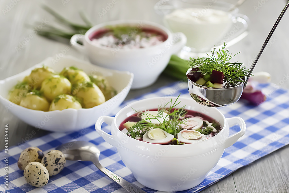 Cold vegetable soup with eggs in white bowl on wooden table. Cold vegetable soup with eggs in white bowl on wooden table.