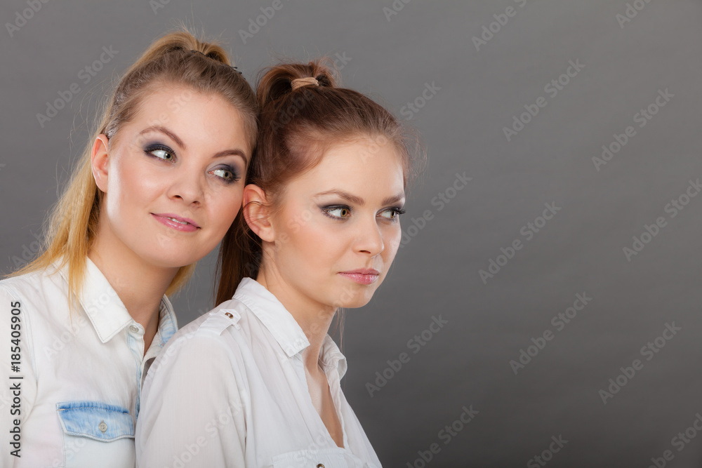 Two beautiful women, blonde and brunette having fun Two beautiful women, blonde and brunette having fun