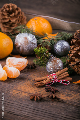 Fototapeta Naklejka Na Ścianę i Meble -  Fresh Tangerines with spices and Christmas decor