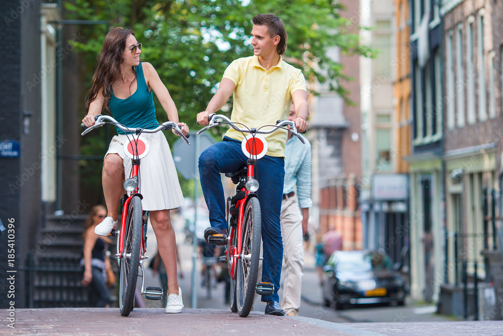 Young happy family on bikes in Amsterdam