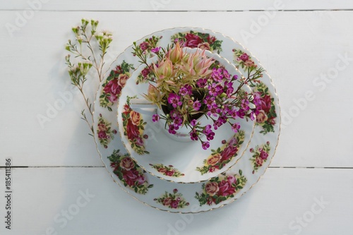 Fototapeta Naklejka Na Ścianę i Meble -  Plate and bowl with flower on white background