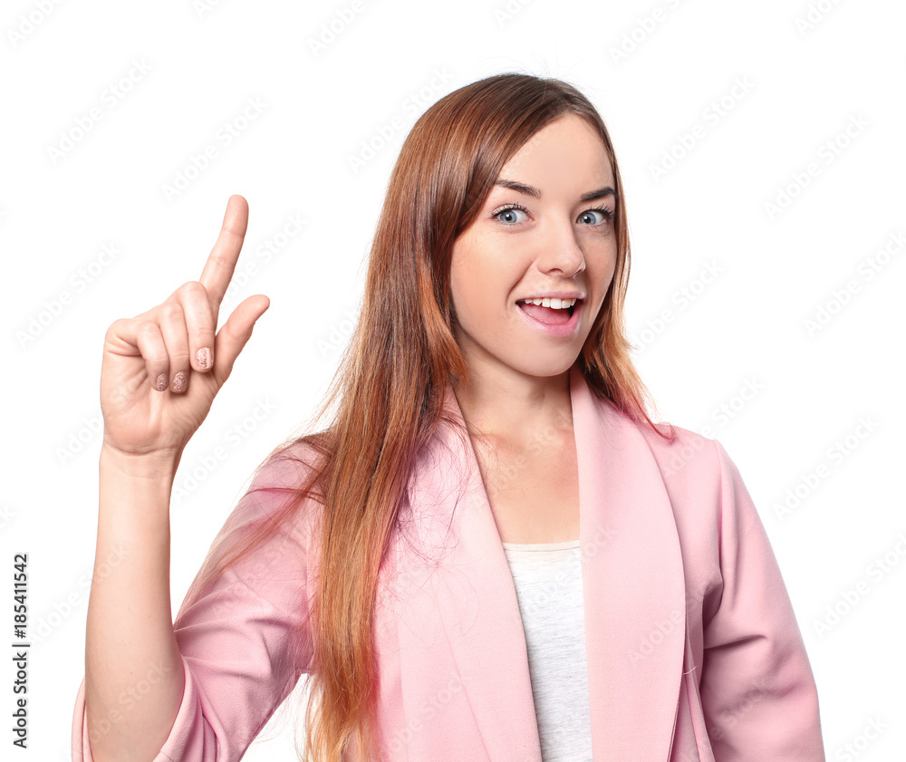 Young attractive woman keeping finger up on white background Young attractive woman keeping finger up on white background