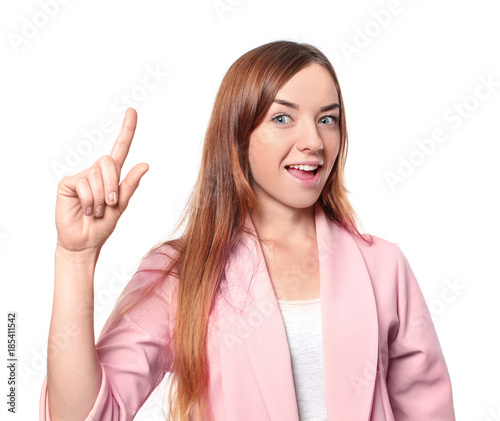 Young attractive woman keeping finger up on white background