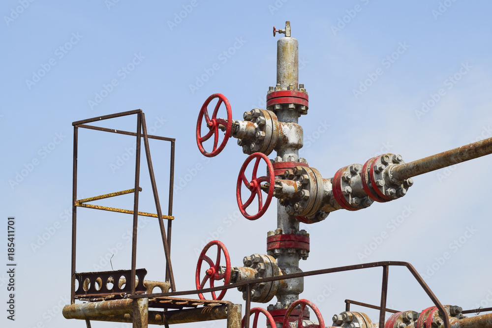 Well for oil and gas production. Oil well wellhead equipment. Oil production Well for oil and gas production. Oil well wellhead equipment. Oil production