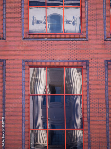 Columns Distorted Reflection in Windows to Look Like Curtains