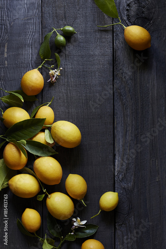 Ripe Meyer lemons on wooden table