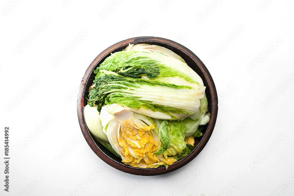 Cabbage for kimchi isolated on crock head Cabbage for kimchi isolated on crock head