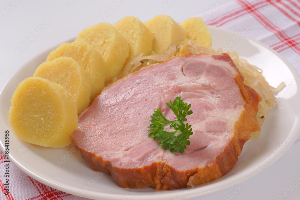 smoked pork with potato dumplings and sauerkraut