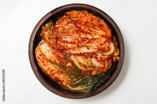 Kimchi on a crock head dish isolated photo