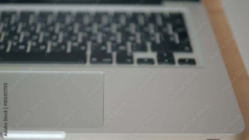 coin bitcoin rolls on the keyboard on the laptop. the concept of trading cryptocurrency. The rapid growth of the currency. spinning in slow motion 180 coin bitcoin rolls on the keyboard on the laptop. the concept of trading cryptocurrency. The rapid growth of the currency. spinning in slow motion 180