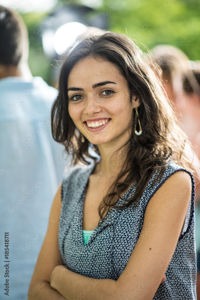 Fototapeta premium During a party outside, Portrait of a young beautiful woman