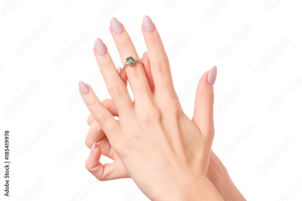 Female hand holding a silver ring bijouterie isolated Female hand holding a silver ring bijouterie isolated