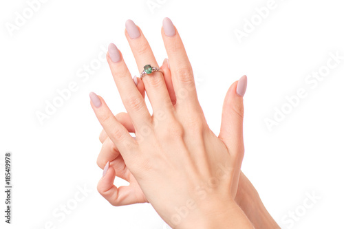 Female hand holding a silver ring bijouterie isolated
