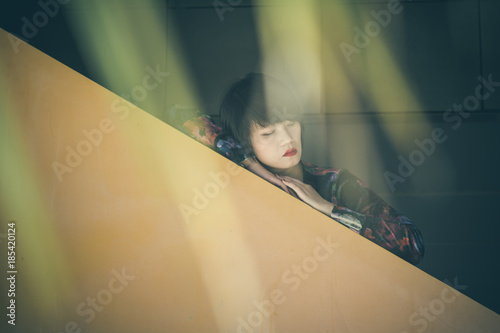 Young pretty Chinese girl, fashion portrait - Portrait of a Chinese lady, dreaming under the shadow of the trees