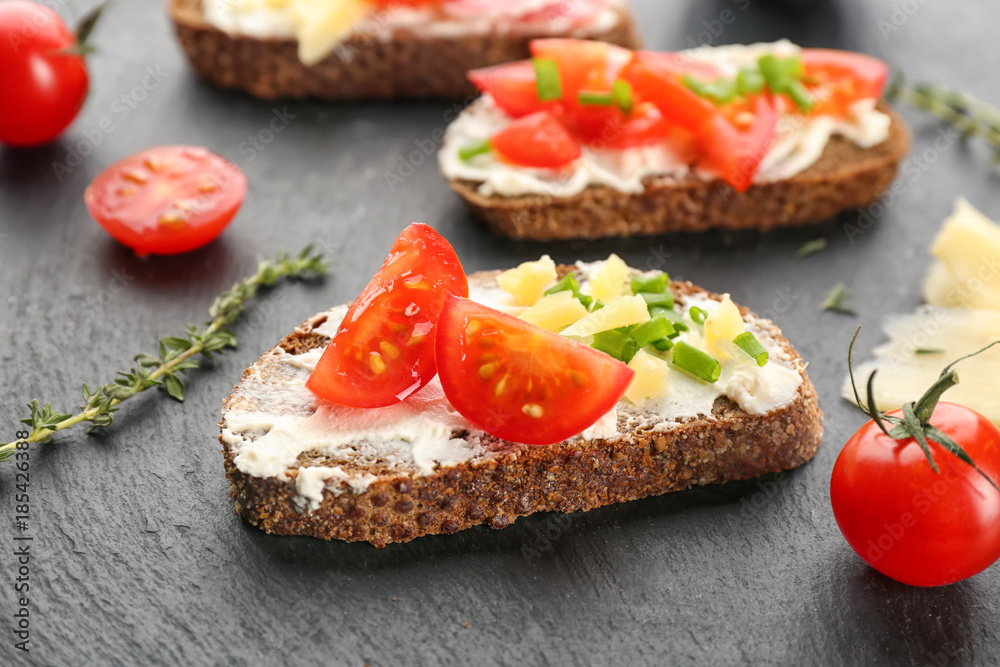 Tasty bruschetta with cherry tomato on table, closeup Tasty bruschetta with cherry tomato on table, closeup