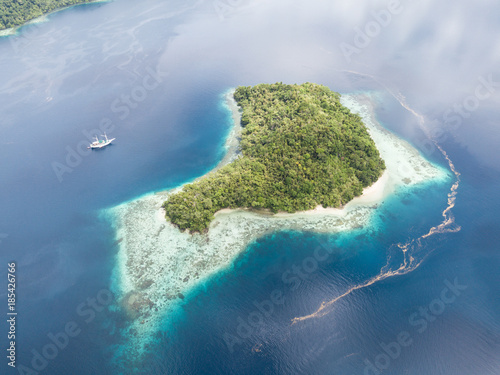Tropical Island and Small Ship in Raja Ampat