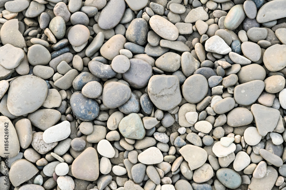 large grey pebble occupies the entire space of the frame large grey pebble occupies the entire space of the frame