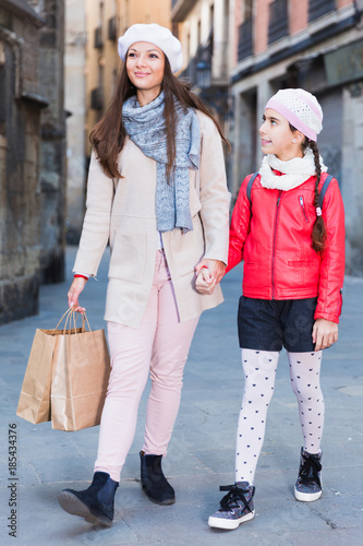 positive woman with daughter walking © JackF