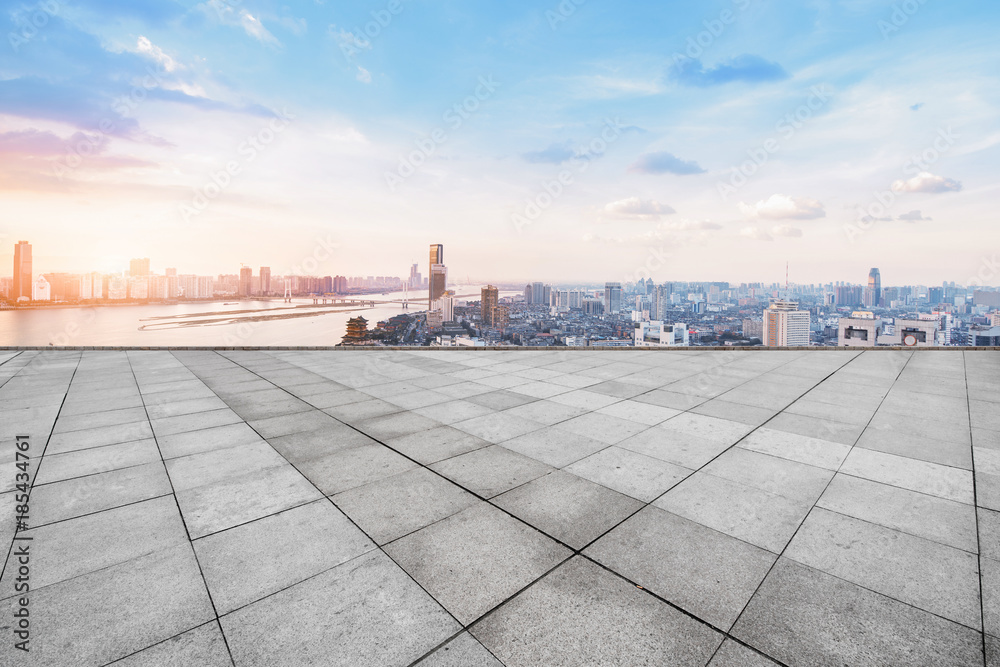 empty marble floor with cityscape and skyline in cloud sky