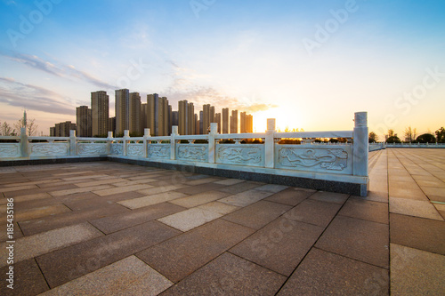 Panoramic skyline and buildings with empty concrete square floor