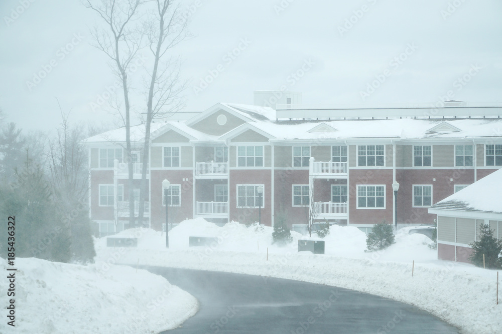 Residential apartment community in blizzard with running snow Residential apartment community in blizzard with running snow