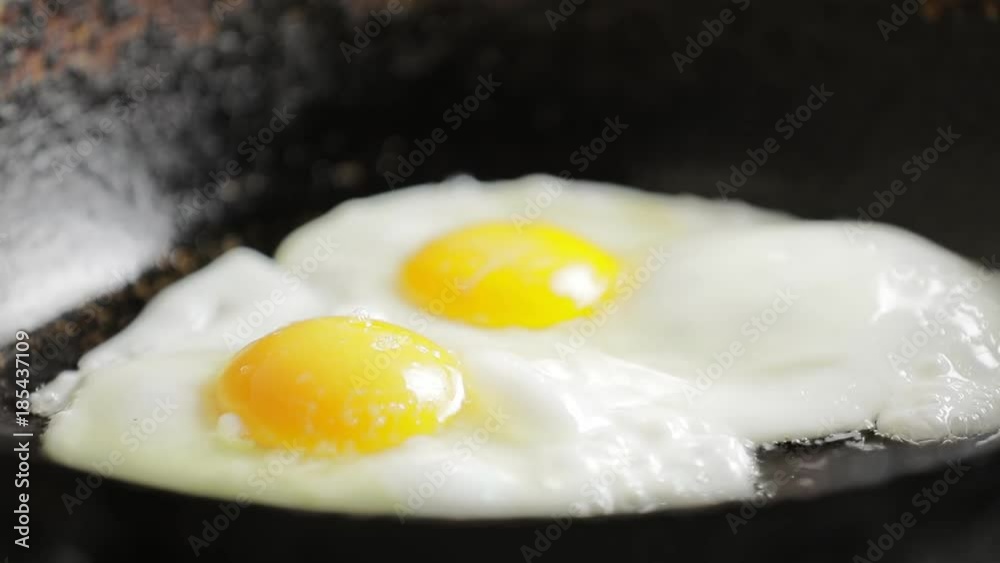 Fry chicken eggs on a pan, prepare omelette Fry chicken eggs on a pan, prepare omelette