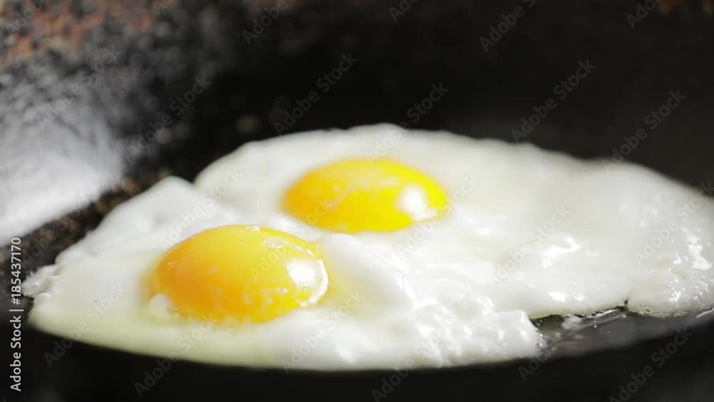 Fry chicken eggs on a pan, prepare omelette Fry chicken eggs on a pan, prepare omelette