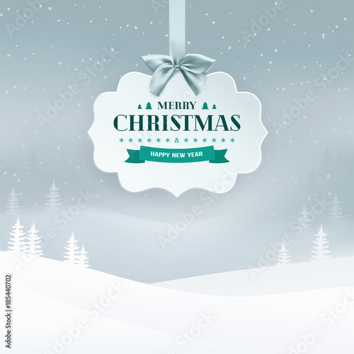 Winter evening scene landscape background with falling snow and trees in the fog. Paper 3D label with silver ribbon and bow and Christmas and New Year vintage badge. Minimal and clean design. Vector.