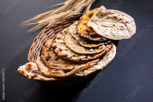 Assorted Indian Bread Basket includes chapati, tandoori roti or naan, paratha, kulcha, fulka, missi roti
 photo