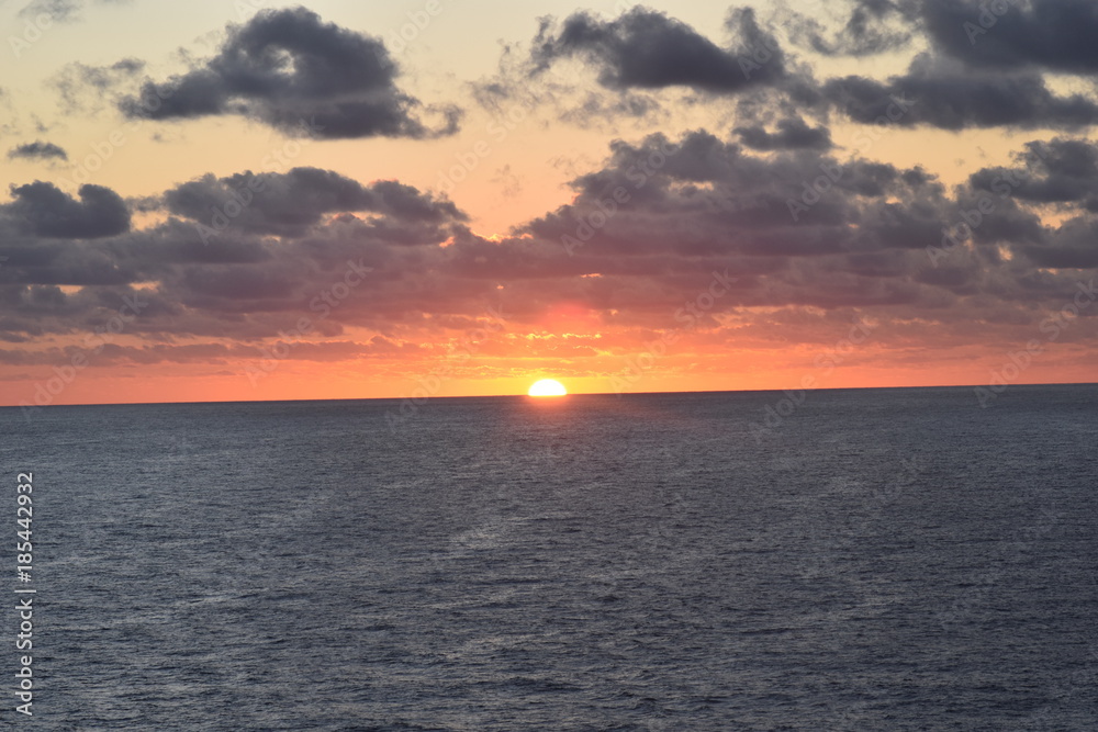 The Clouds and Sun Rising over the Ocean The Clouds and Sun Rising over the Ocean
