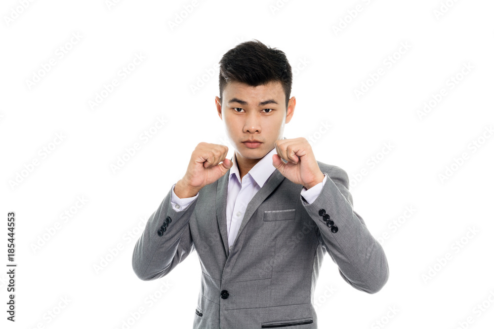 Portrait of a business man preparing for fight. Isolated on white background Portrait of a business man preparing for fight. Isolated on white background