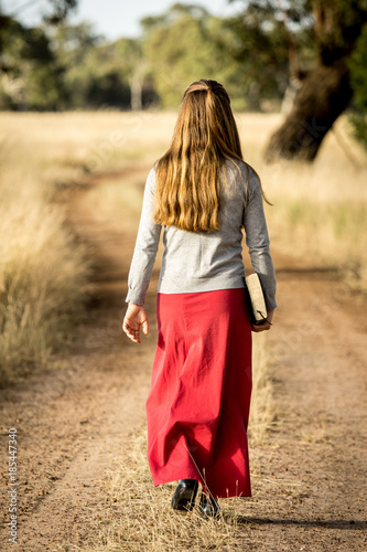 Lady going for a walk with Bible 