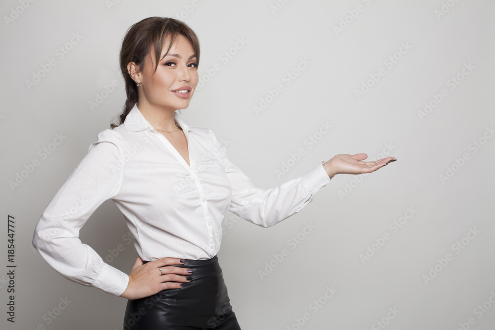 Young beauty woman holding hand presentation on white bg Young beauty woman holding hand presentation on white bg