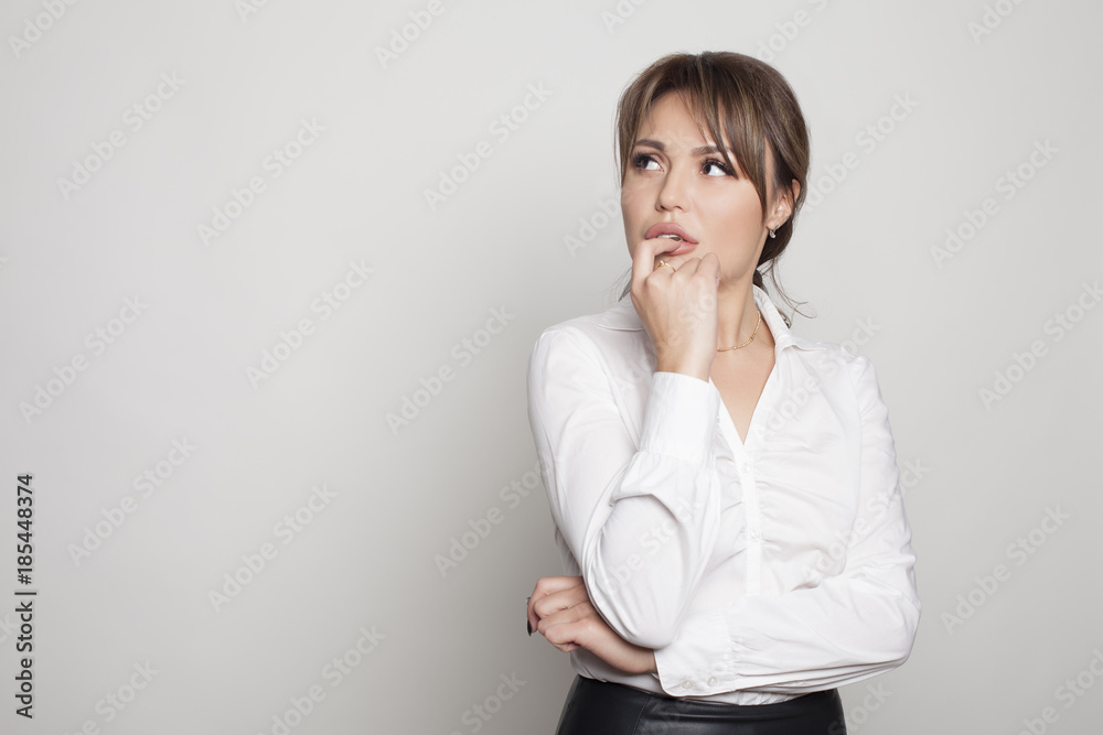 Business woman think concept on a white bg studio shot Business woman think concept on a white bg studio shot
