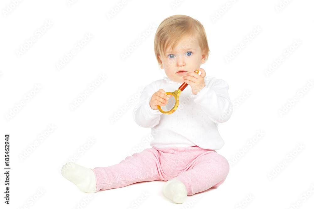 Caucasian baby girl holding magnifying glass isolated on white background Caucasian baby girl holding magnifying glass isolated on white background